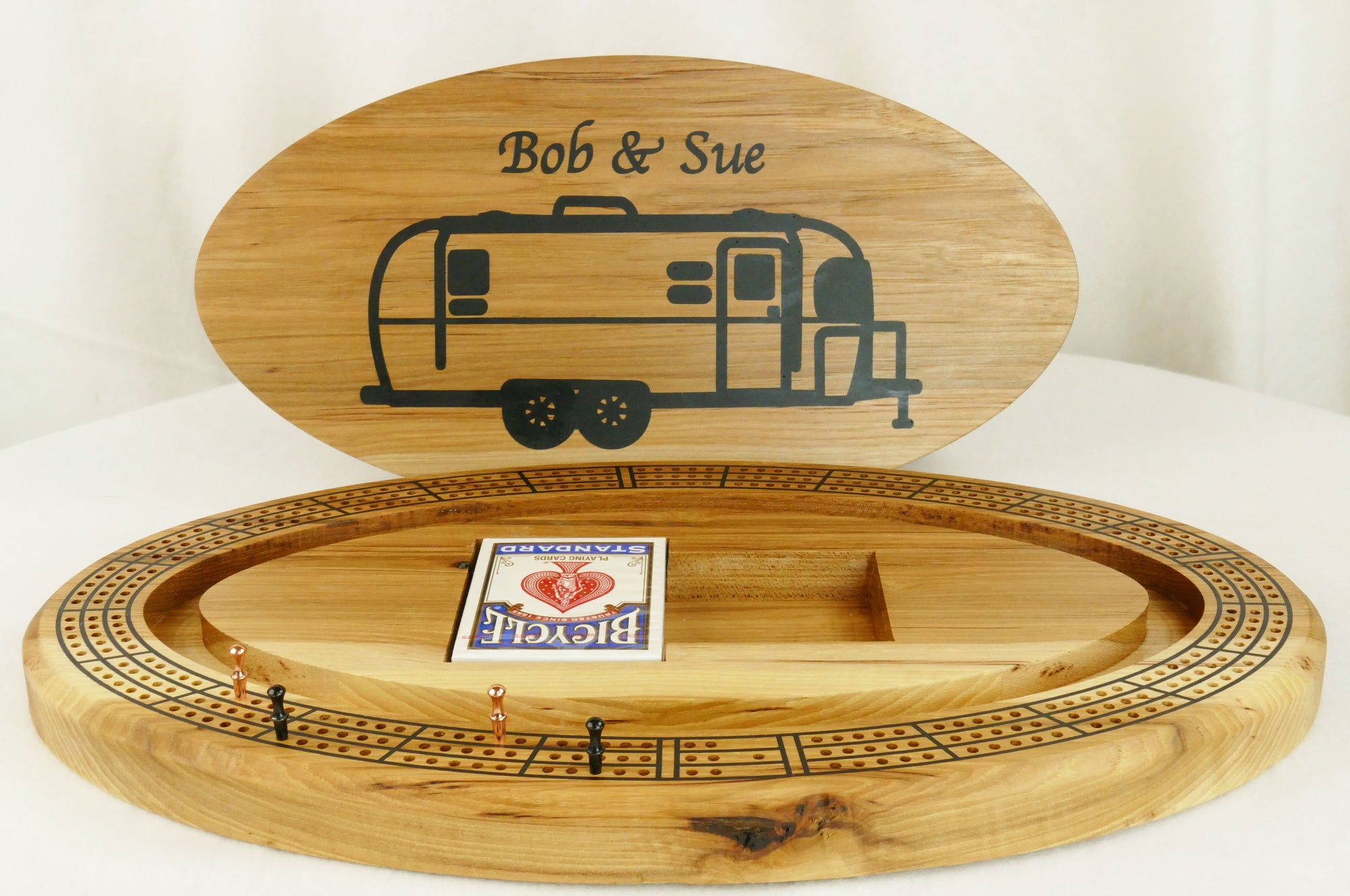 Airstream Cribbage Board with Top off showing the card storage area and peg storage area. 